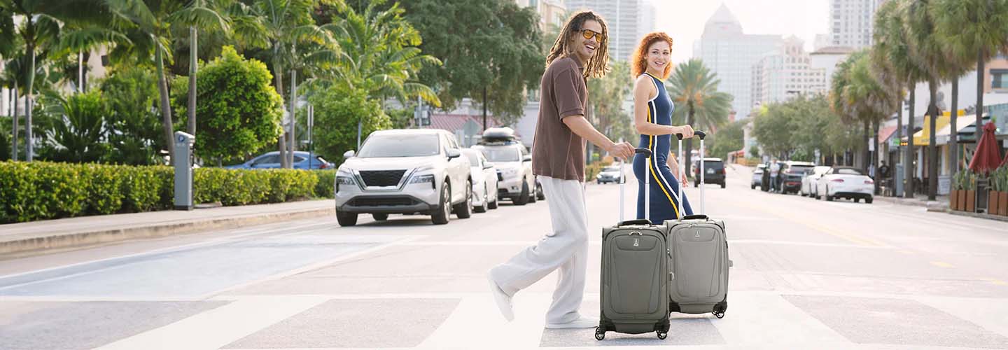 People walking with Travelpro Maxlite 5 luggage